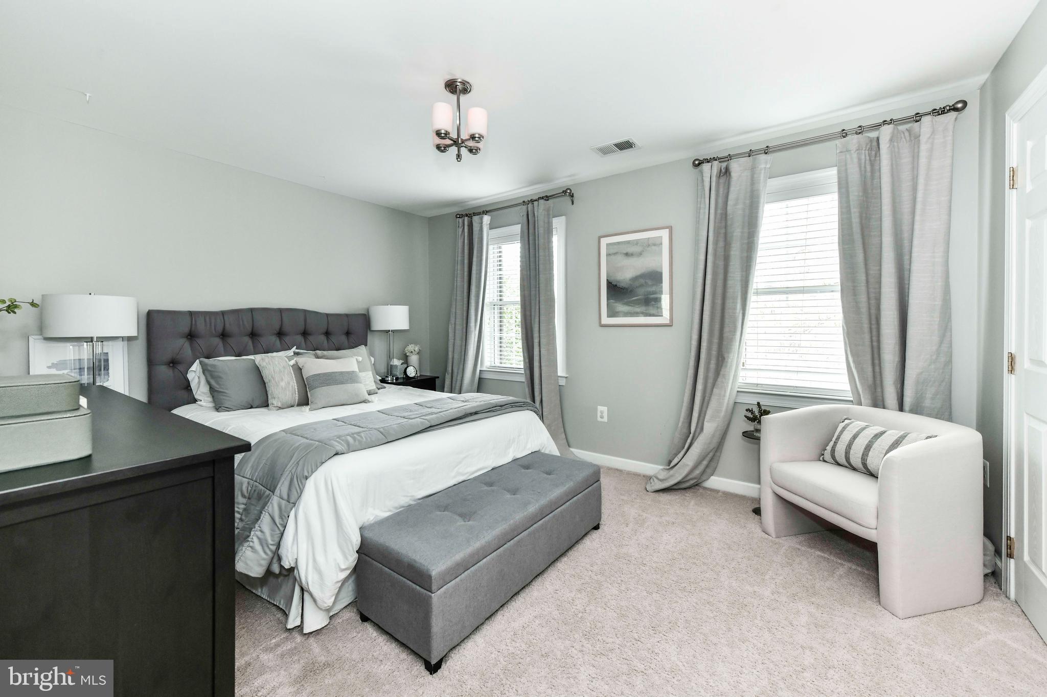 6866 Melrose Drive McLean, VA 22101 - Photo 27 of 42 a spacious bedroom with a bed and window