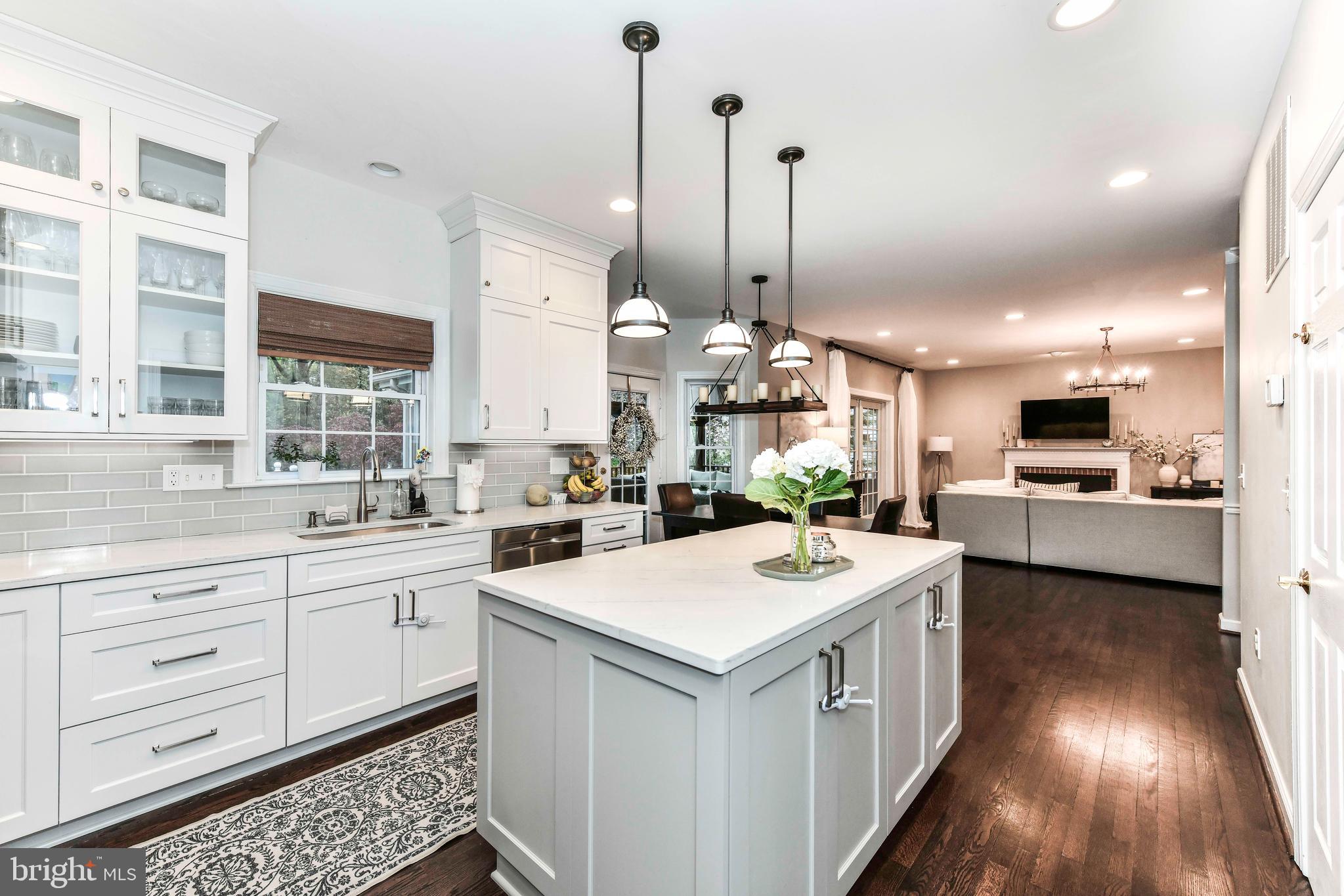 6866 Melrose Drive McLean, VA 22101 - Photo 4 of 42 a kitchen with a sink a counter top space and stainless steel appliances