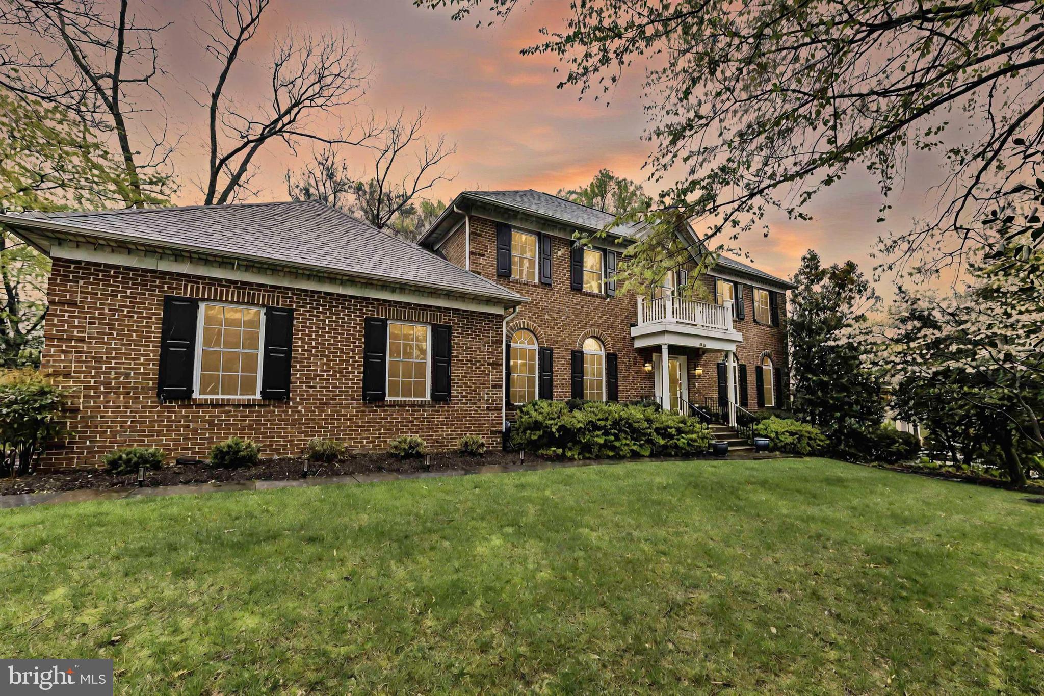 6866 Melrose Drive McLean, VA 22101 - Photo 42 of 42 a front view of a house with a garden