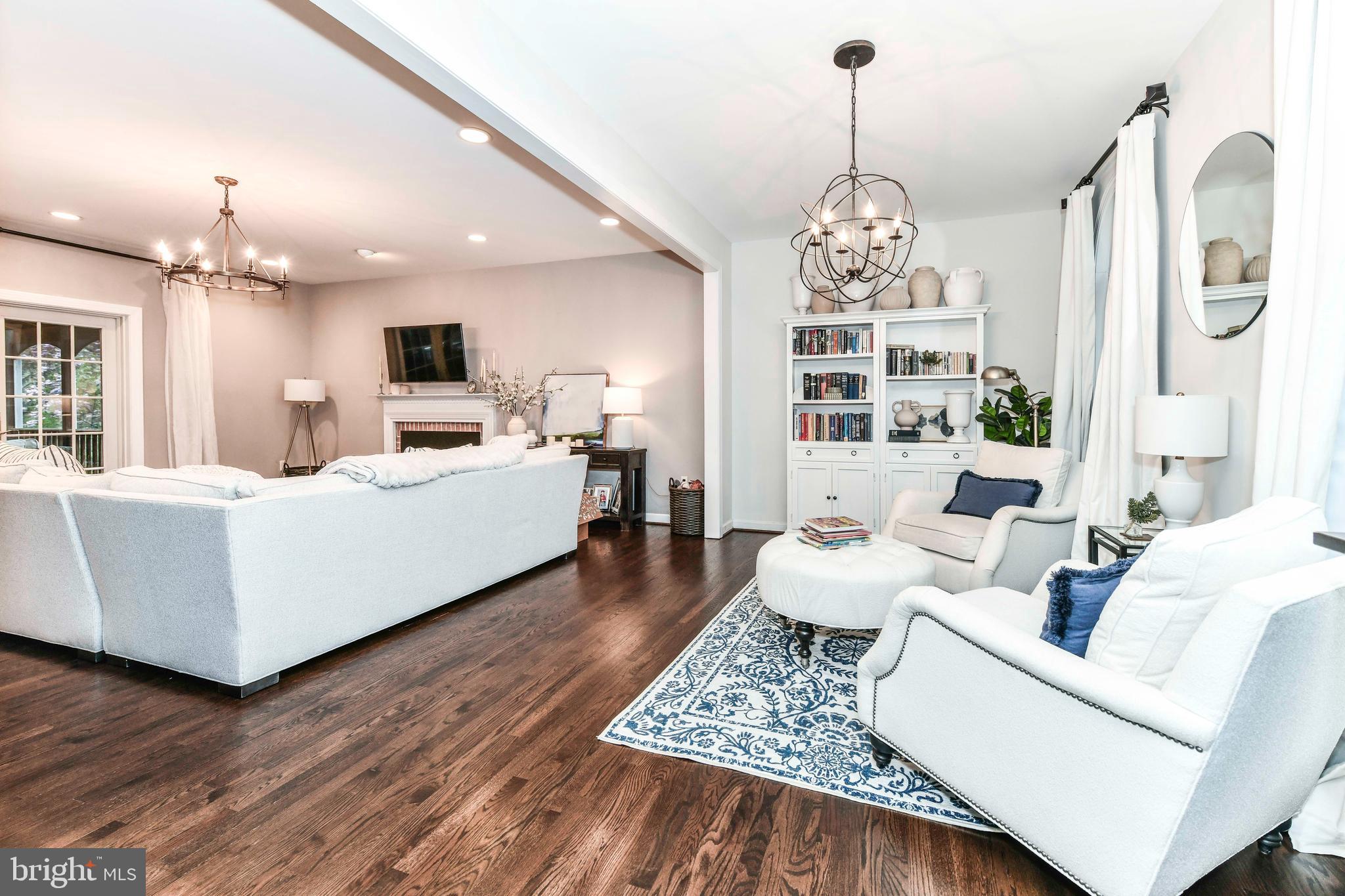 6866 Melrose Drive McLean, VA 22101 - Photo 8 of 42 a living room with furniture a chandelier and a chandelier