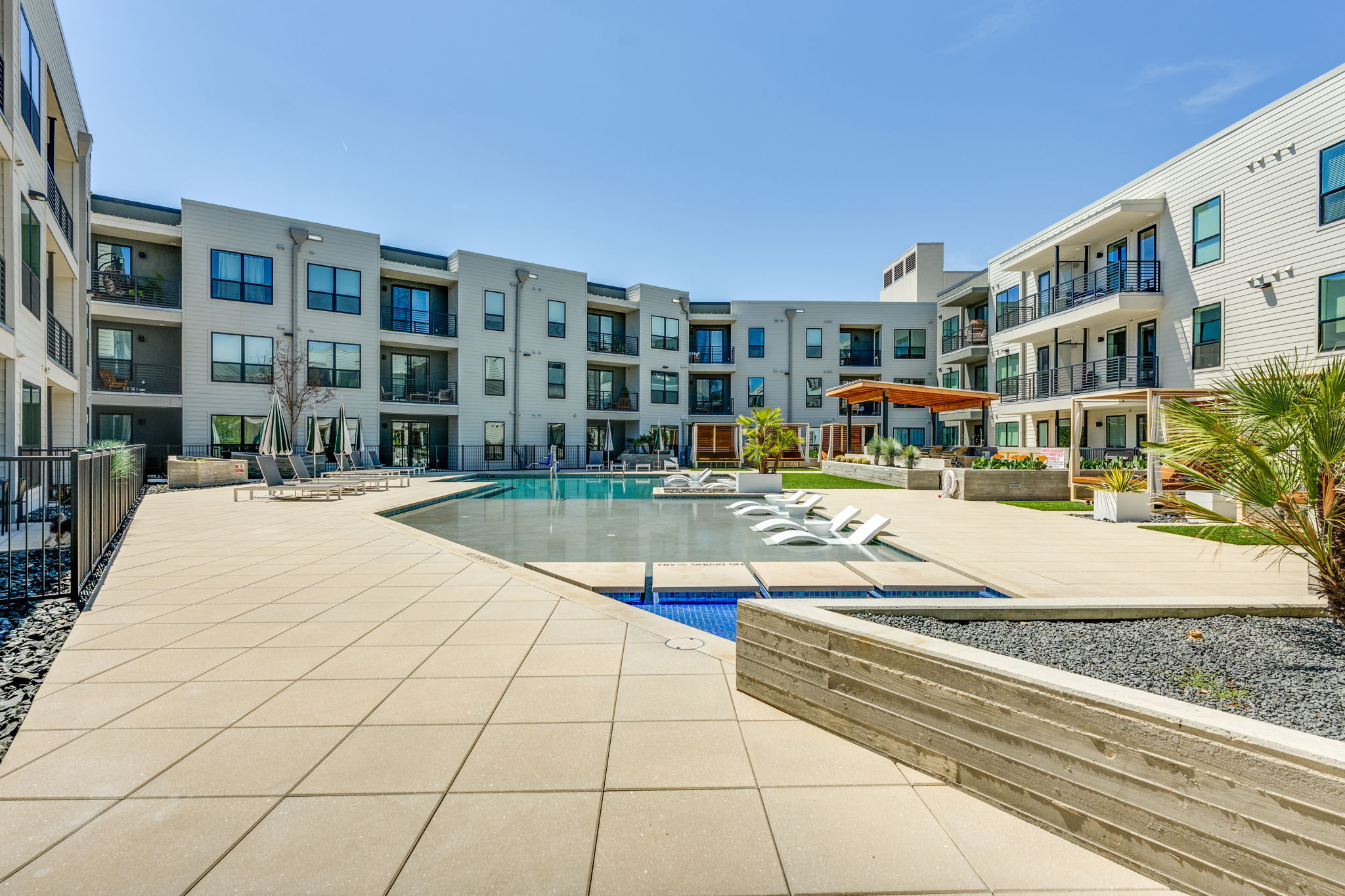 1701 Simond Avenue, Unit 524 Austin, TX 78723 - Photo 23 of 30 a view of an buildings with swimming pool