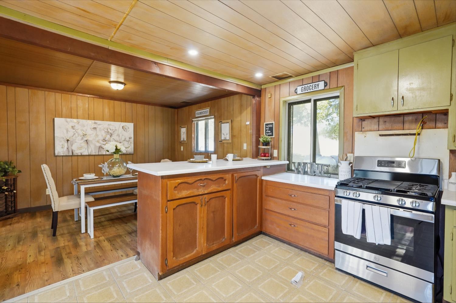 13351 Newtown Road Nevada City, CA 95959 - Photo 33 of 50 a kitchen with granite countertop a sink cabinets and stainless steel appliances