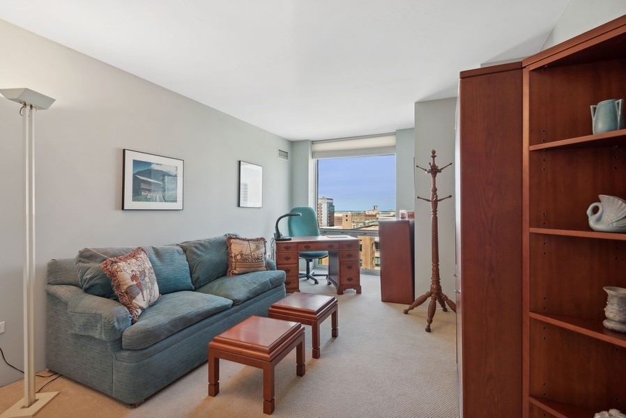 1640 Maple Avenue, Unit 1107 Evanston, IL 60201 - Photo 10 of 28 a living room with furniture and a window