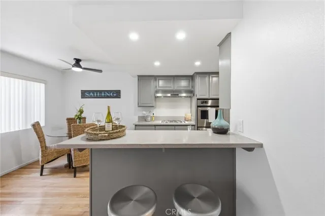 a kitchen with a table and chairs in it