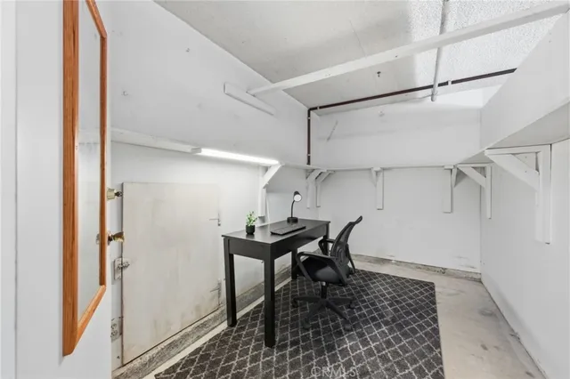 a workspace with furniture and a rug