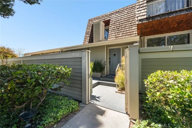 a front view of a house with a glass door