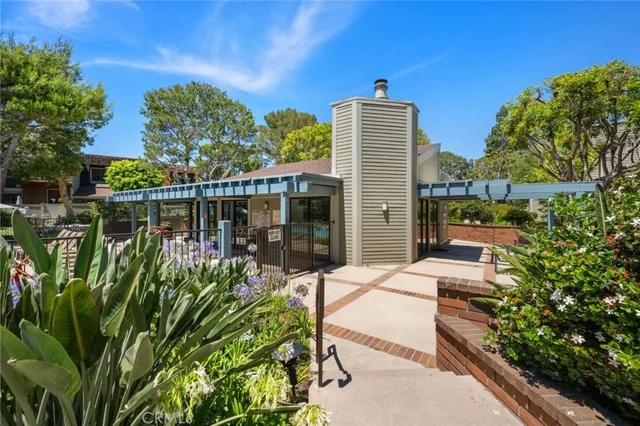 a view of a chairs and table in patio with a lake view