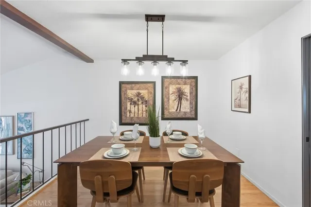 a view of a dining room with furniture and chandelier