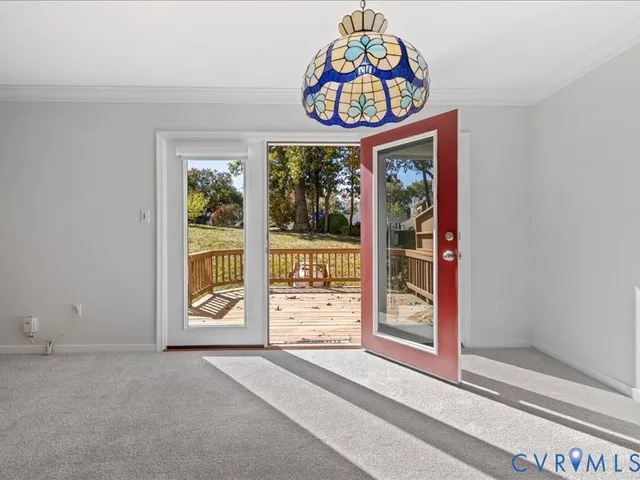 a view of a balcony with wooden floor and fence