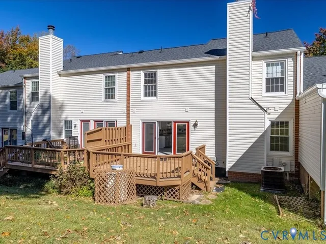 an empty room with a fireplace and window
