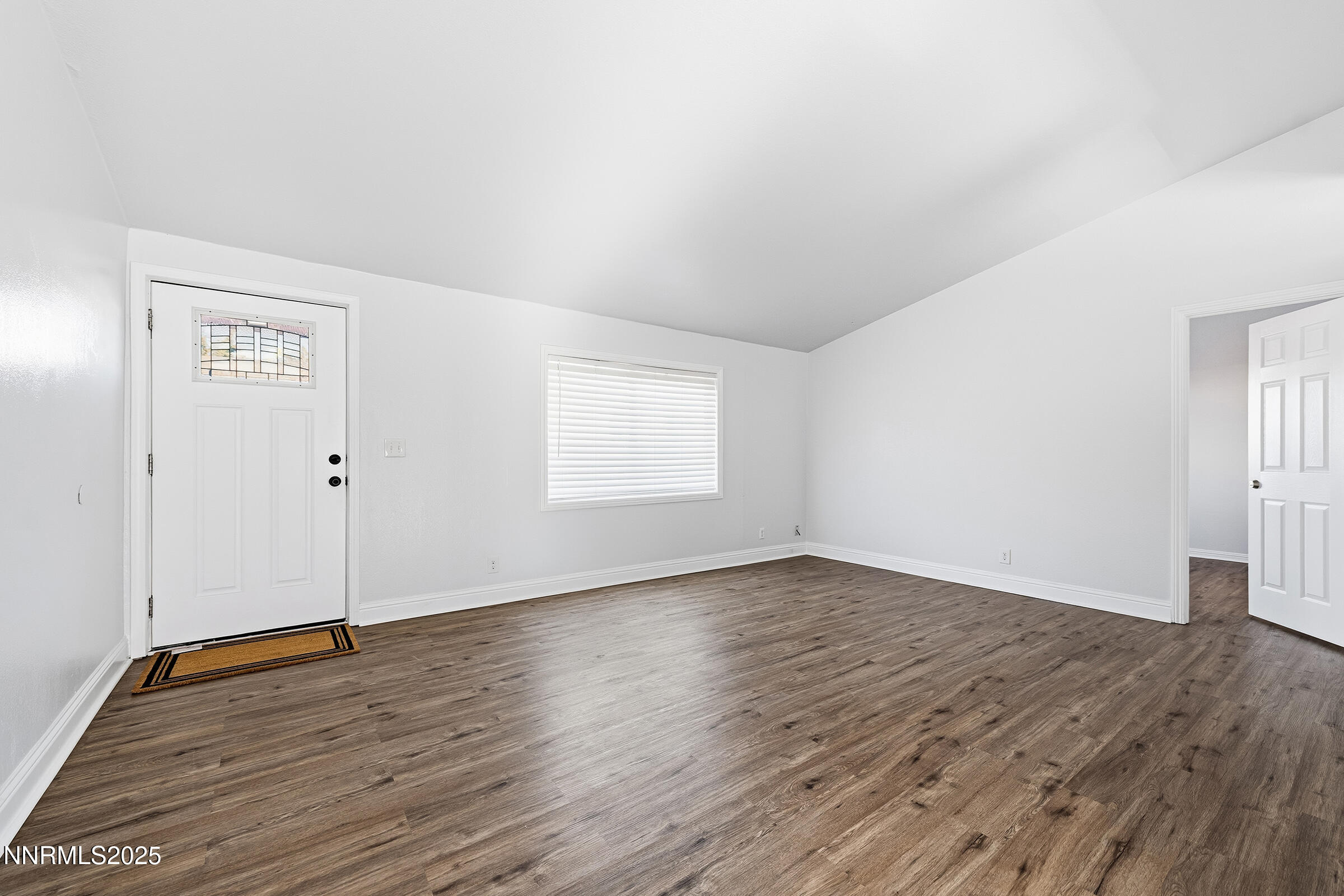 2650 Daffodil Way Reno, NV 89512 - Photo 2 of 22 an empty room with wooden floor and windows