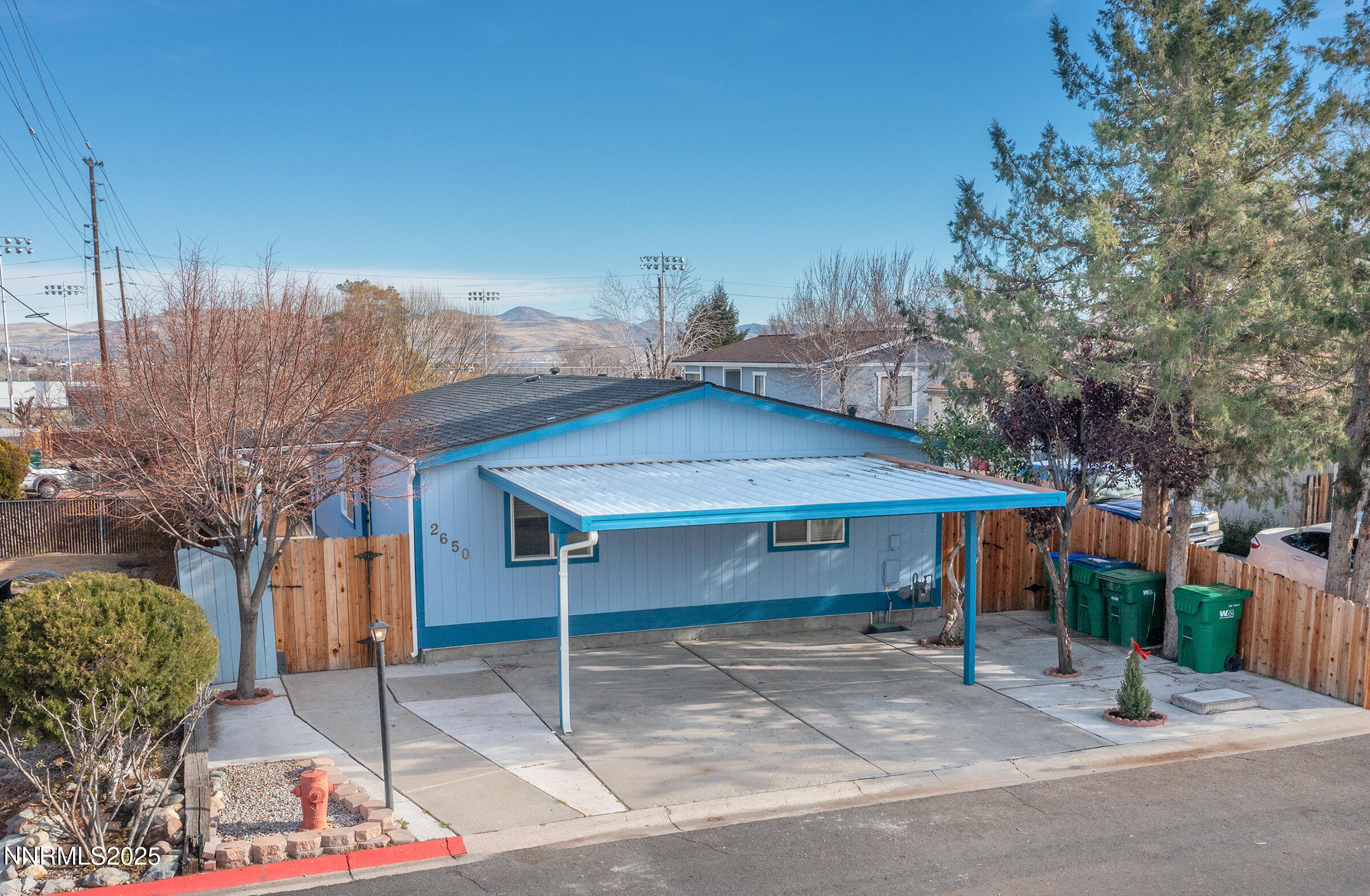 2650 Daffodil Way Reno, NV 89512 - Photo 22 of 22 a view of a house with a patio and a yard