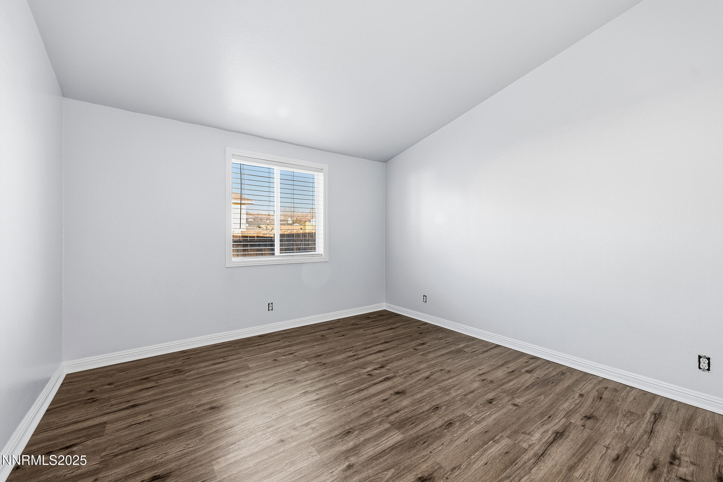 2650 Daffodil Way Reno, NV 89512 - Photo 4 of 22 wooden floor in an empty room with a window