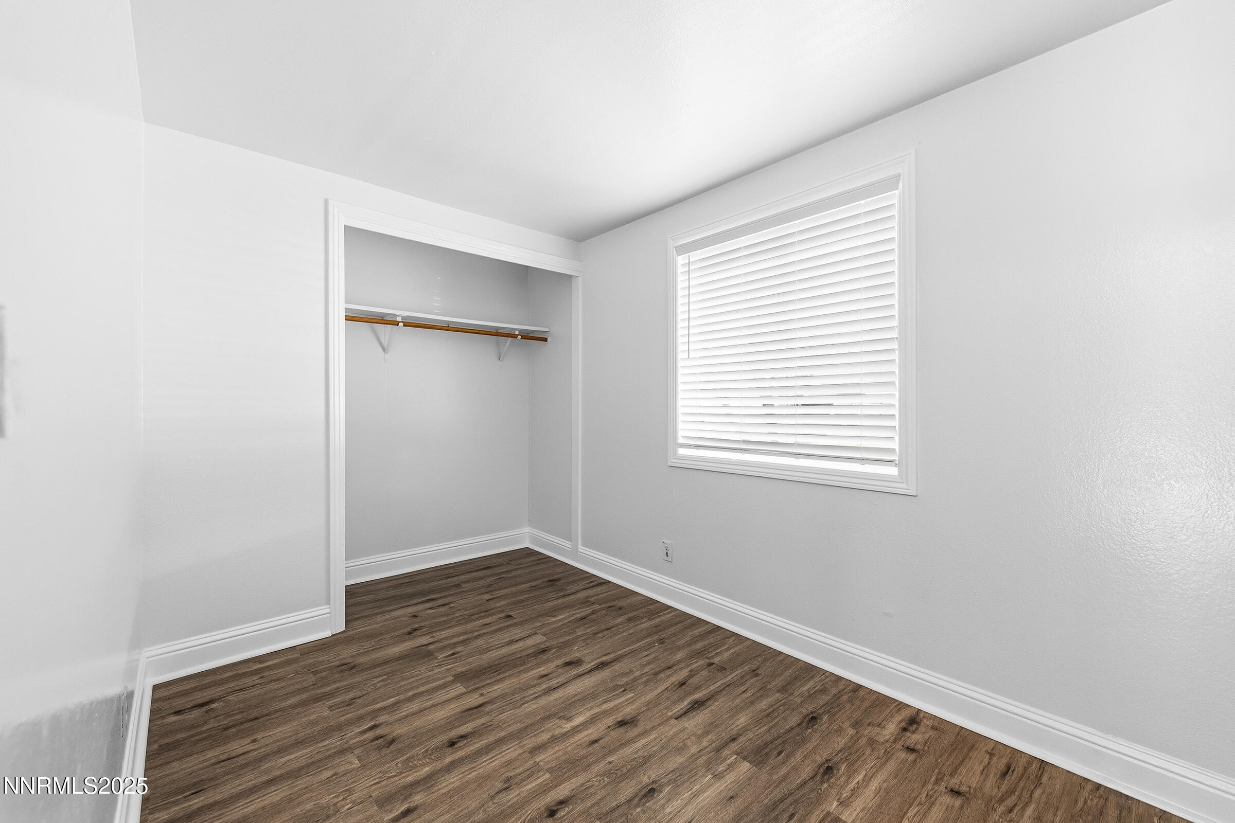 2650 Daffodil Way Reno, NV 89512 - Photo 9 of 22 an empty room with wooden floor and windows