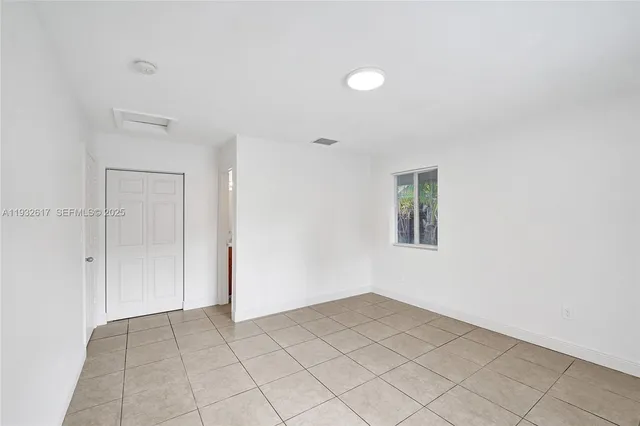 an empty room with a empty space and window