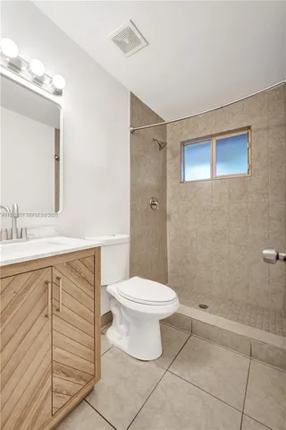 a view of a kitchen with a sink and a window