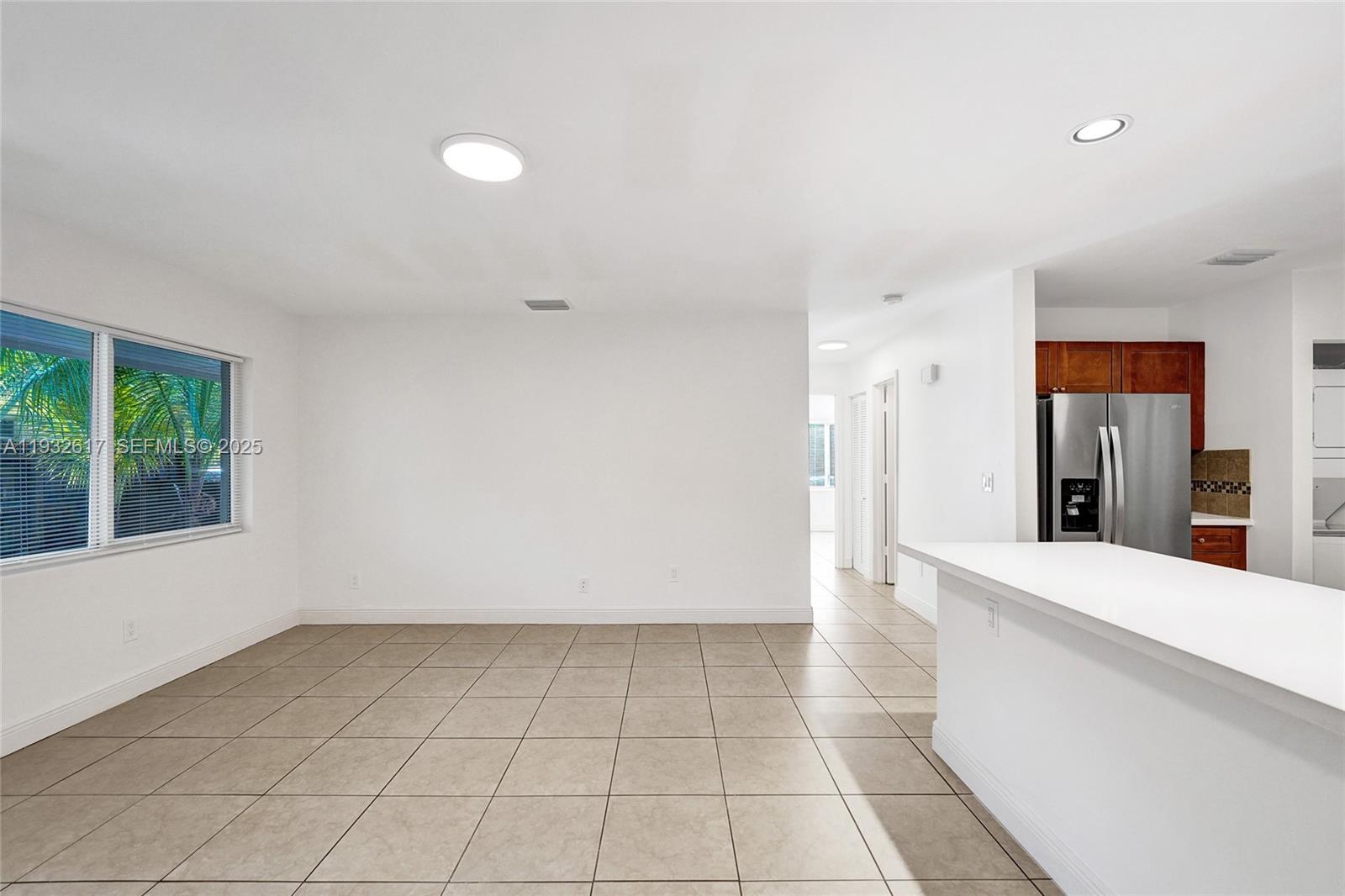 30 Southwest 8th Street, Unit 1 Hallandale Beach, FL 33009 - Photo 44 of 75 a view of a kitchen with a sink and a window