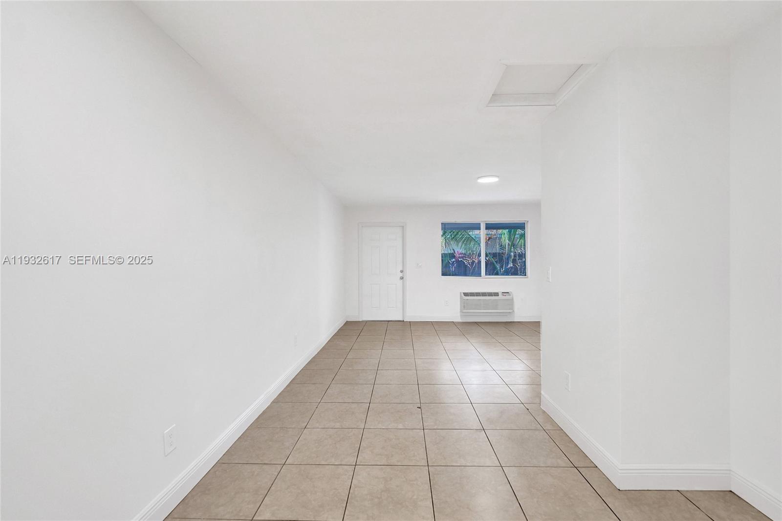 30 Southwest 8th Street, Unit 1 Hallandale Beach, FL 33009 - Photo 68 of 75 a view of an empty room with a window