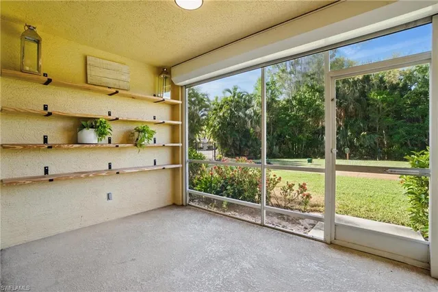a room with natural light and large windows