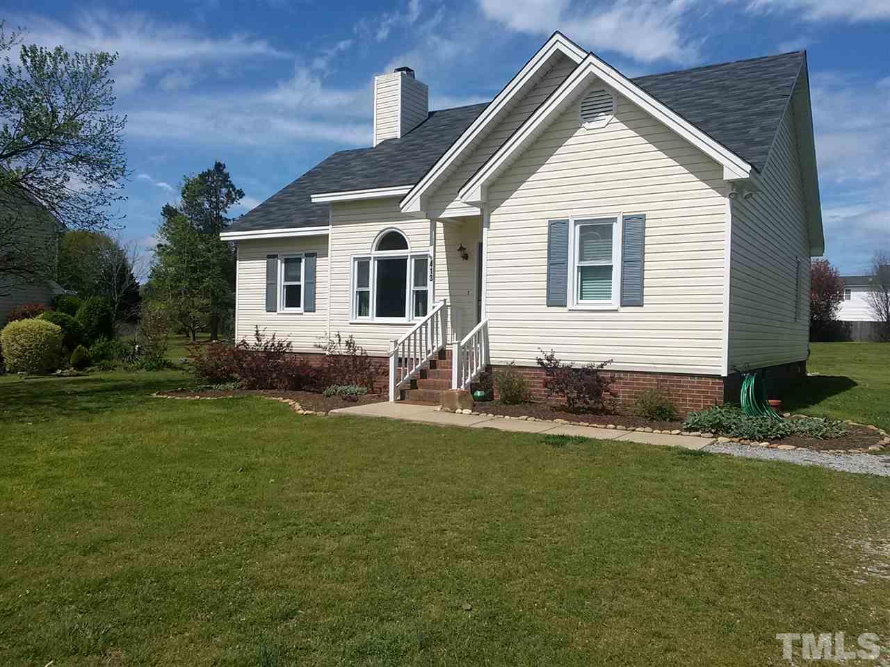 413 South Meadow Road Raleigh, NC 27603 - Photo 1 of 3 a front view of a house with a yard