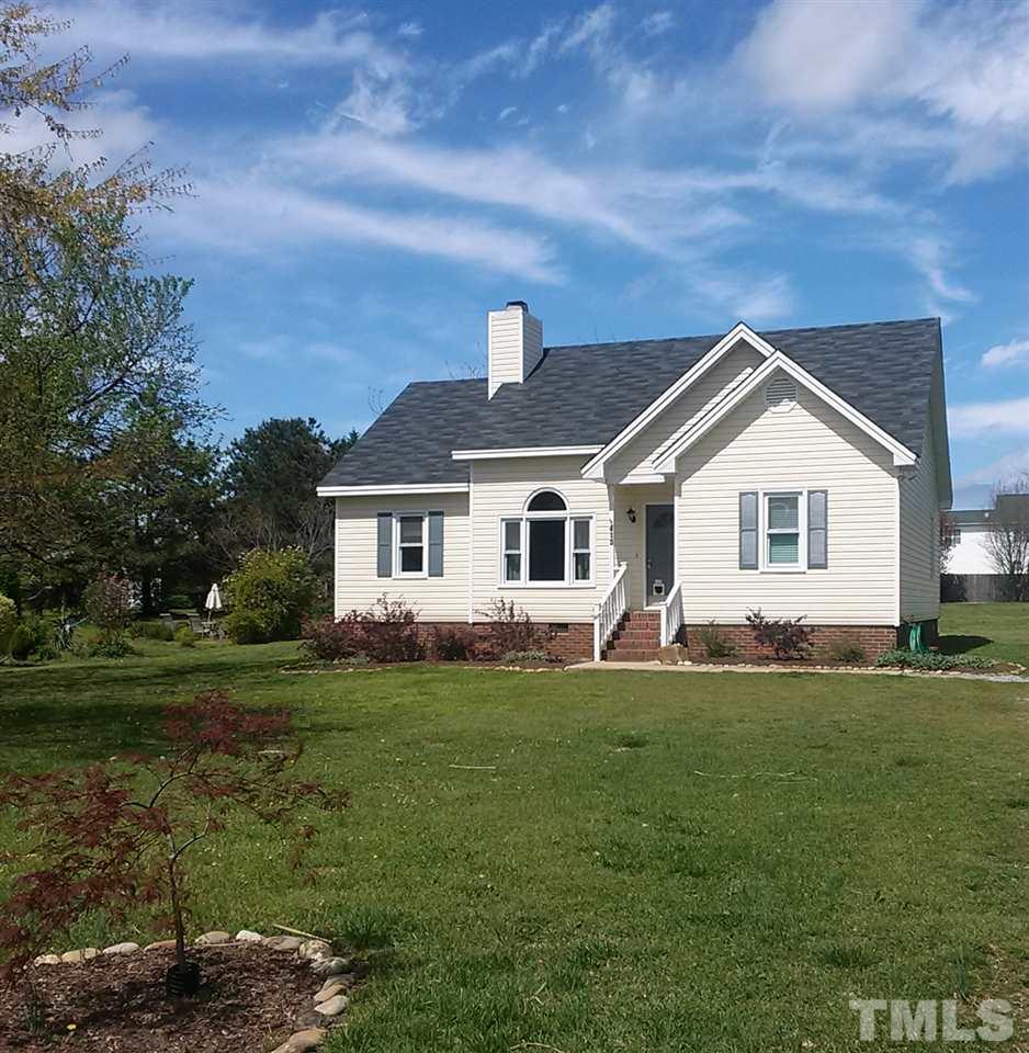 413 South Meadow Road Raleigh, NC 27603 - Photo 2 of 3 a front view of a house with a yard