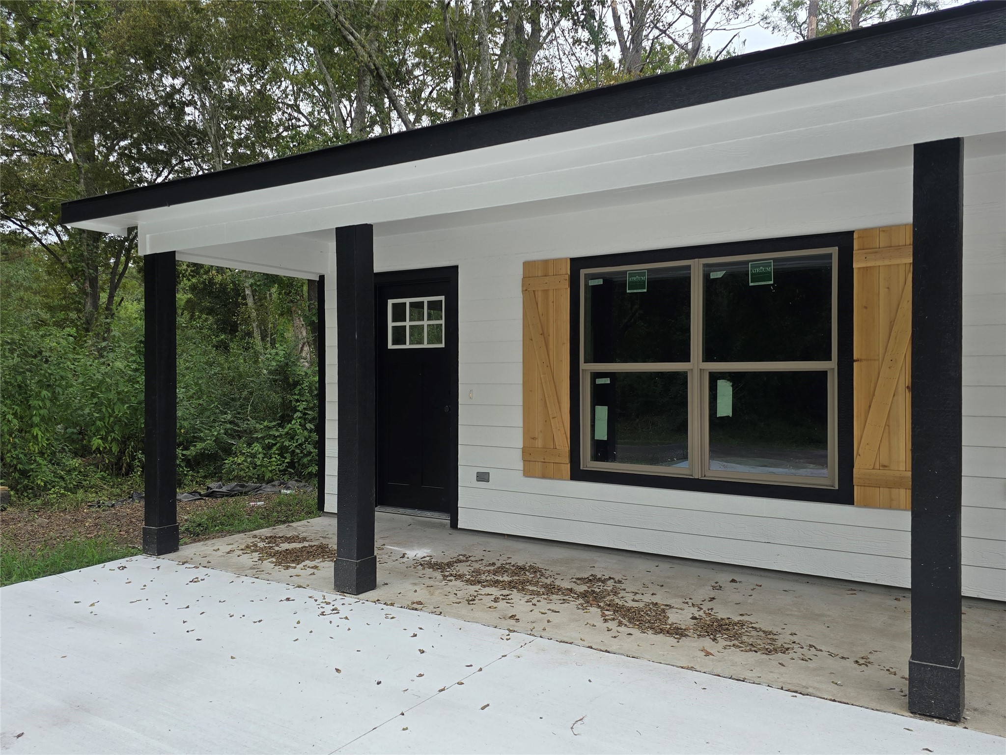 3516 Hunnicutt Street, Unit A Dayton, TX 77535 - Photo 4 of 4 a couple of window and a tree