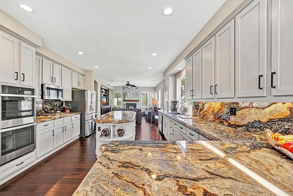 1463 Belmont Park Road Oceanside, CA 92057 - Photo 20 of 50 a large kitchen with cabinets