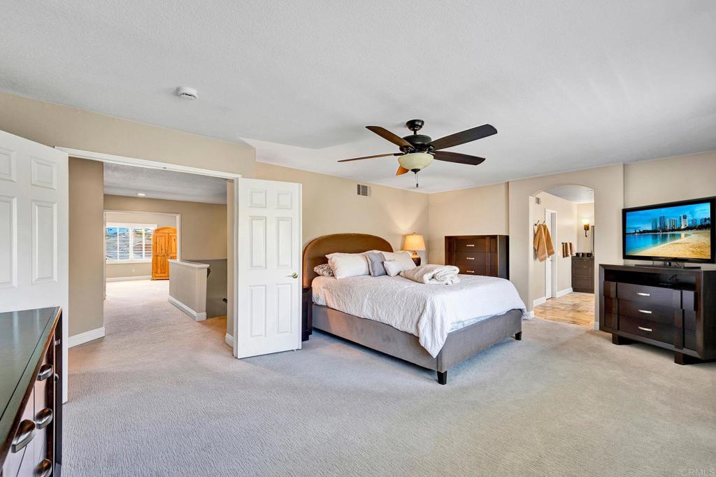 1463 Belmont Park Road Oceanside, CA 92057 - Photo 25 of 50 a bed room with a bed and a television