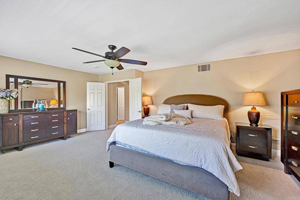 1463 Belmont Park Road Oceanside, CA 92057 - Photo 26 of 50 a bedroom with a bed and a dresser