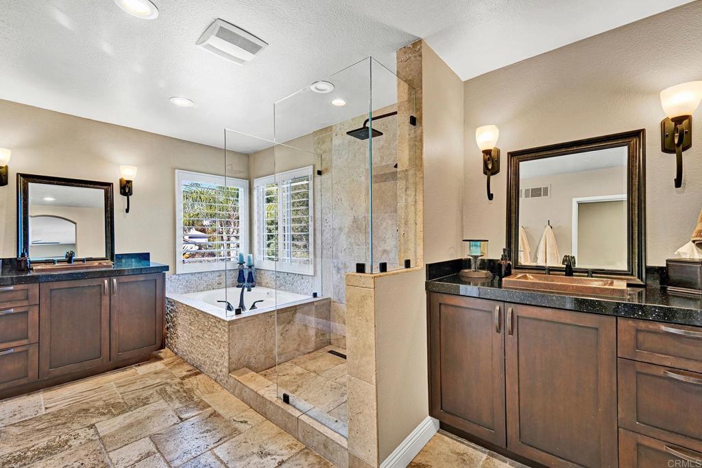 1463 Belmont Park Road Oceanside, CA 92057 - Photo 27 of 50 a spacious bathroom with a tub sink and mirror