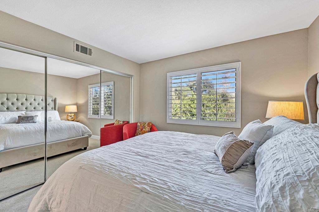 1463 Belmont Park Road Oceanside, CA 92057 - Photo 30 of 50 a bedroom with two beds and a large window