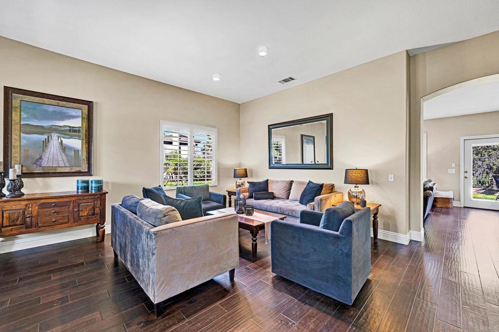 1463 Belmont Park Road Oceanside, CA 92057 - Photo 3 of 50 a living room with furniture and a flat screen tv