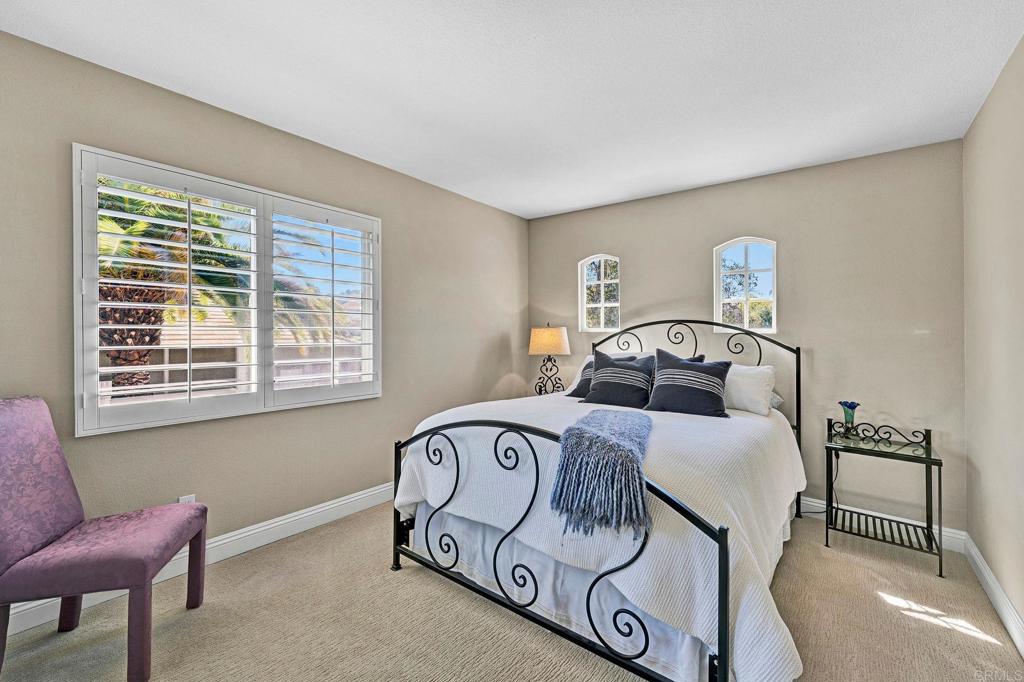 1463 Belmont Park Road Oceanside, CA 92057 - Photo 31 of 50 a bedroom with a bed and a window