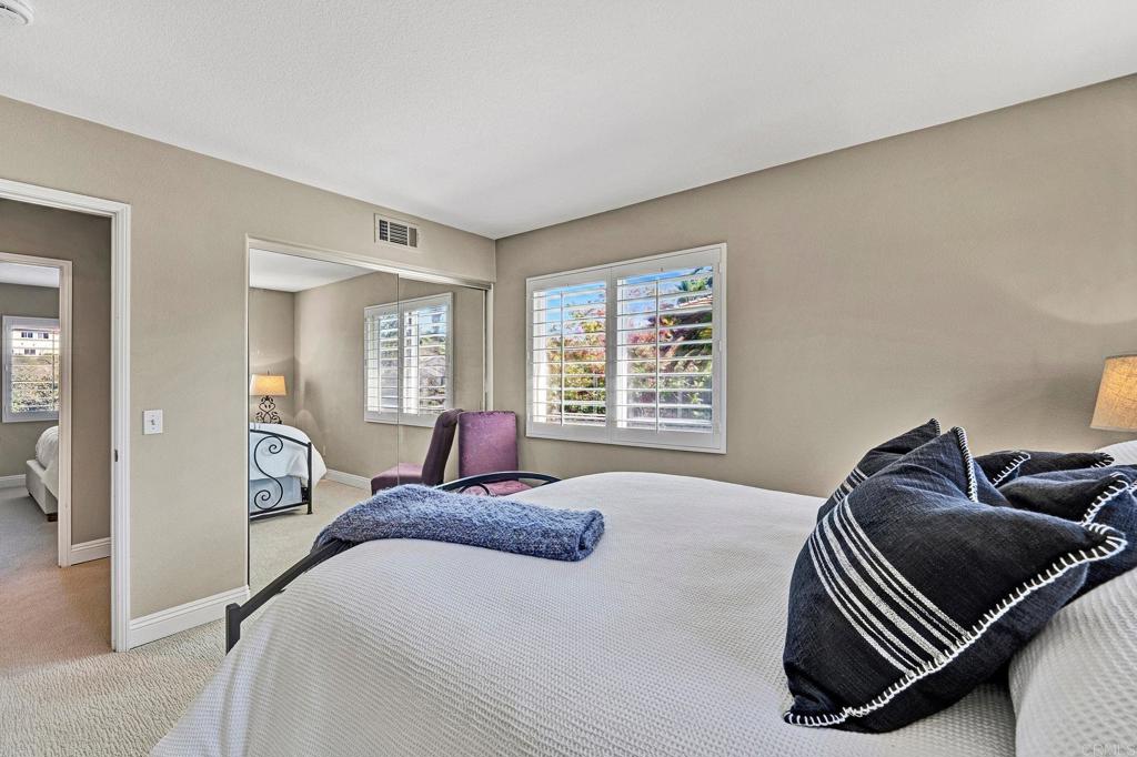 1463 Belmont Park Road Oceanside, CA 92057 - Photo 32 of 50 a bedroom with a bed and a window