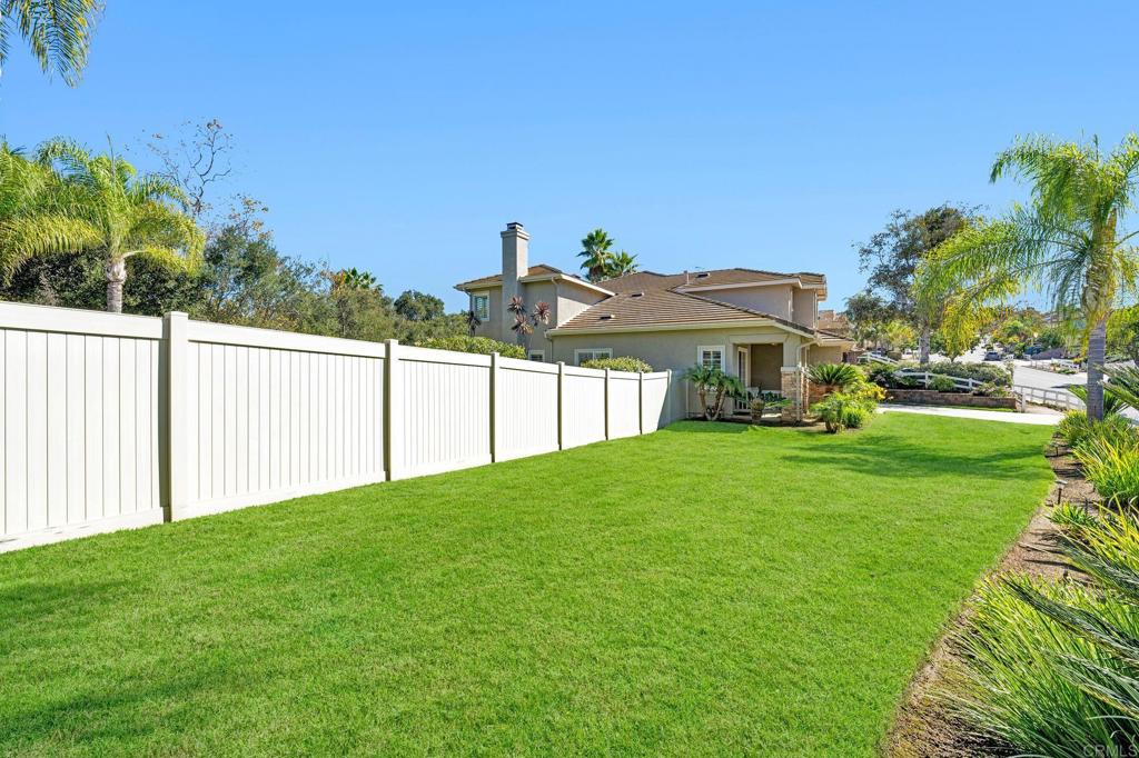 1463 Belmont Park Road Oceanside, CA 92057 - Photo 44 of 50 a view of a big yard with plants and large trees