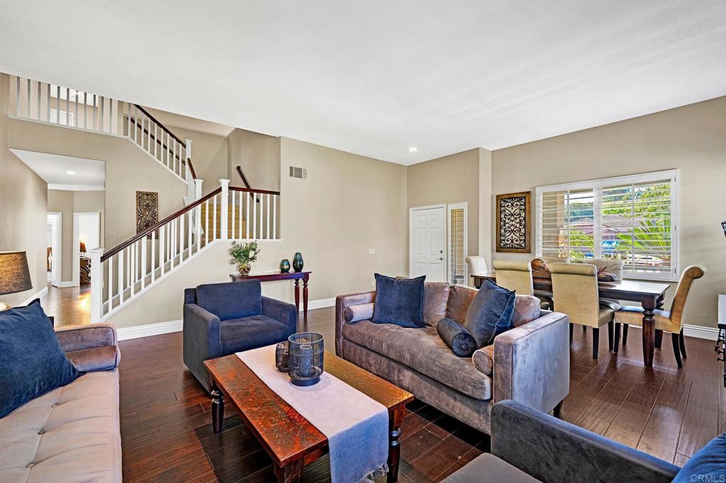 1463 Belmont Park Road Oceanside, CA 92057 - Photo 8 of 50 a living room with furniture and a wooden floor