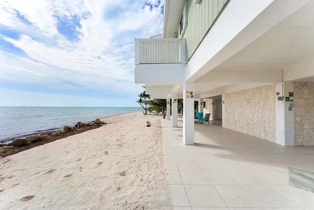 a view of a house with a window and sitting area