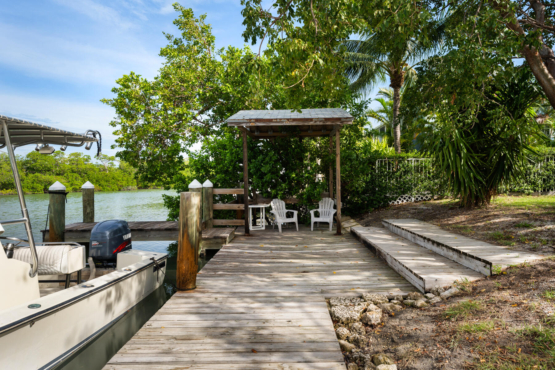 133 Sunset Drive Islamorada, FL 33036 - Photo 22 of 81 a view of a patio with chairs and potted plants