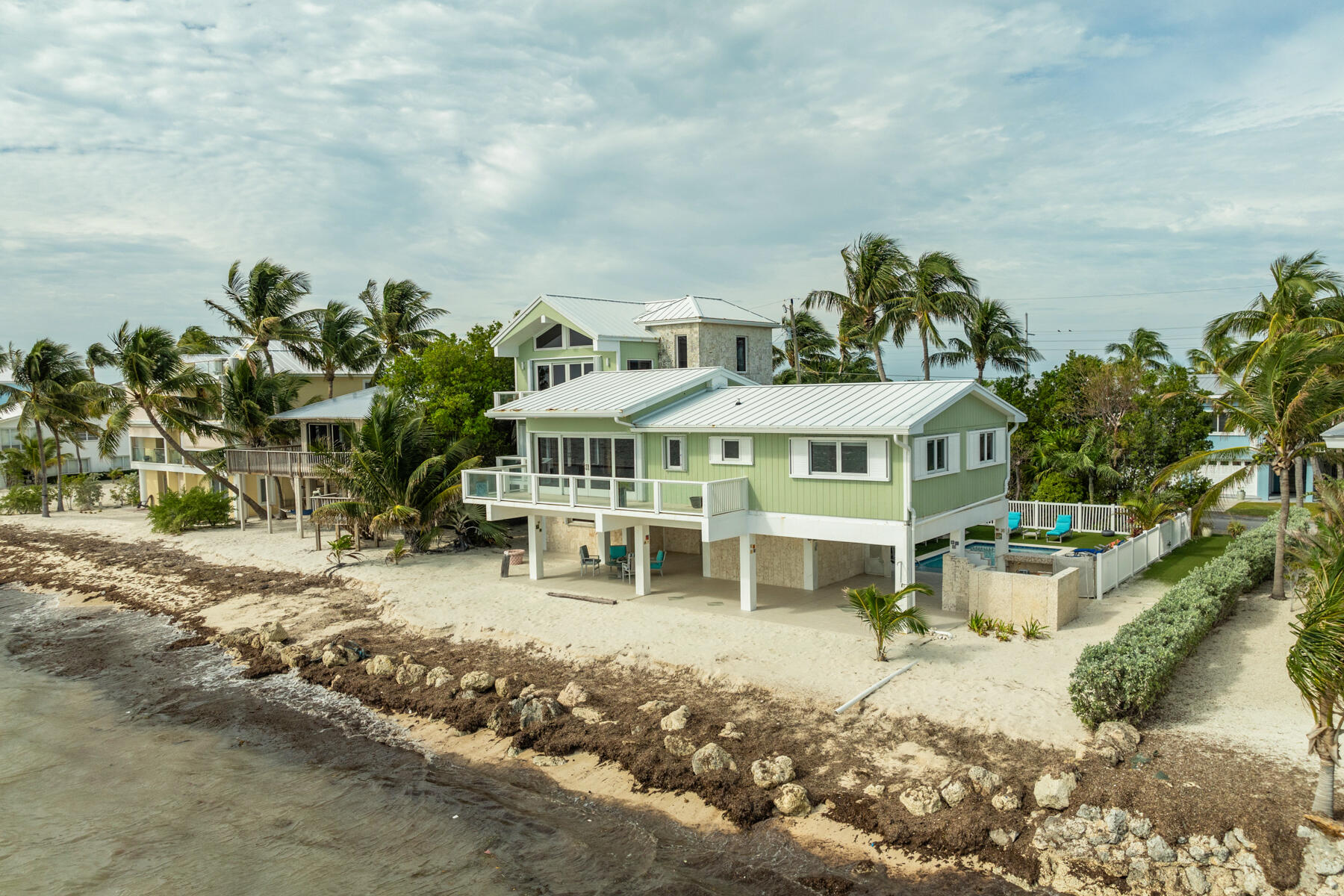133 Sunset Drive Islamorada, FL 33036 - Photo 27 of 81 a view of a house with a yard and sitting area