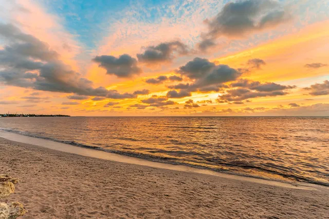 a dining room with furniture and entryway