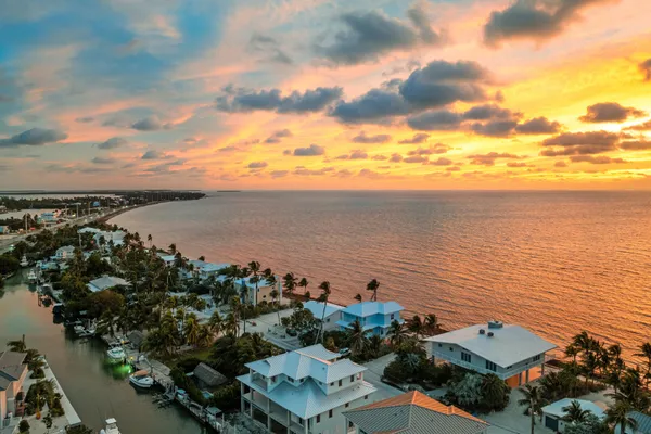 a bedroom with two beds and a window