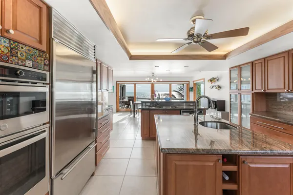 a view of a balcony with potted plants