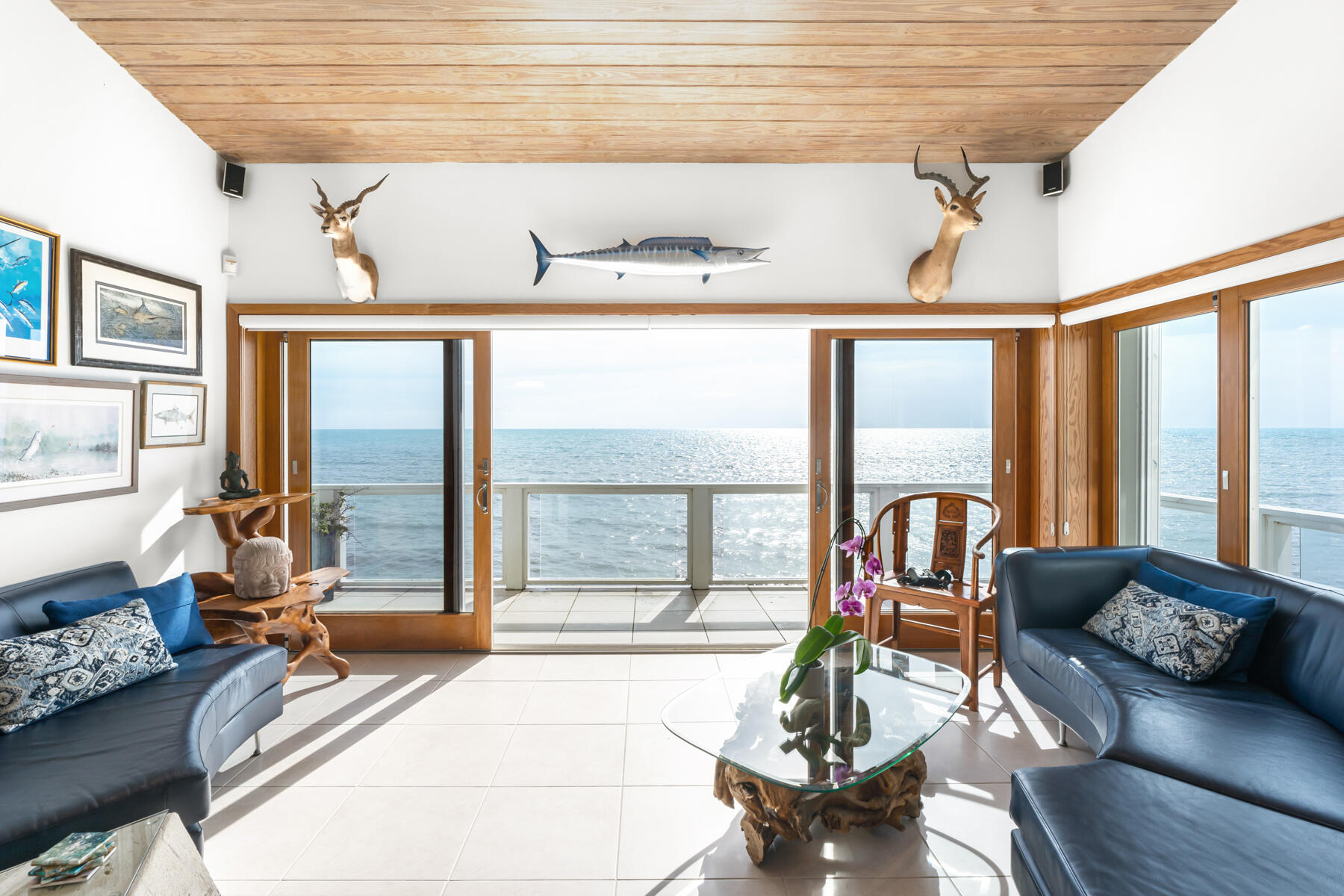 133 Sunset Drive Islamorada, FL 33036 - Photo 48 of 81 a living room with furniture and floor to ceiling windows