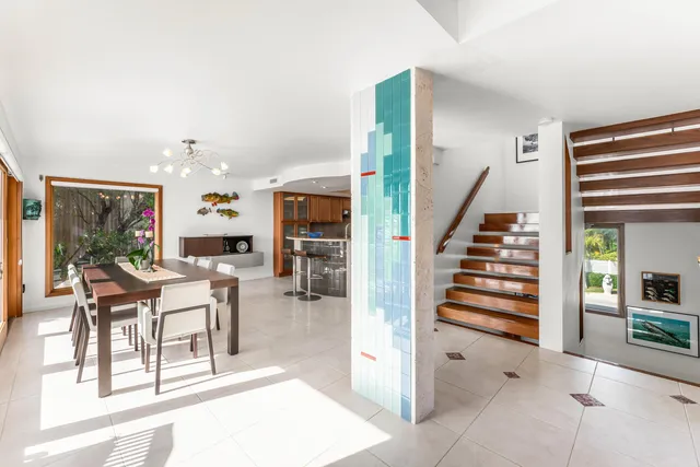 an aerial view of a houses with ocean view