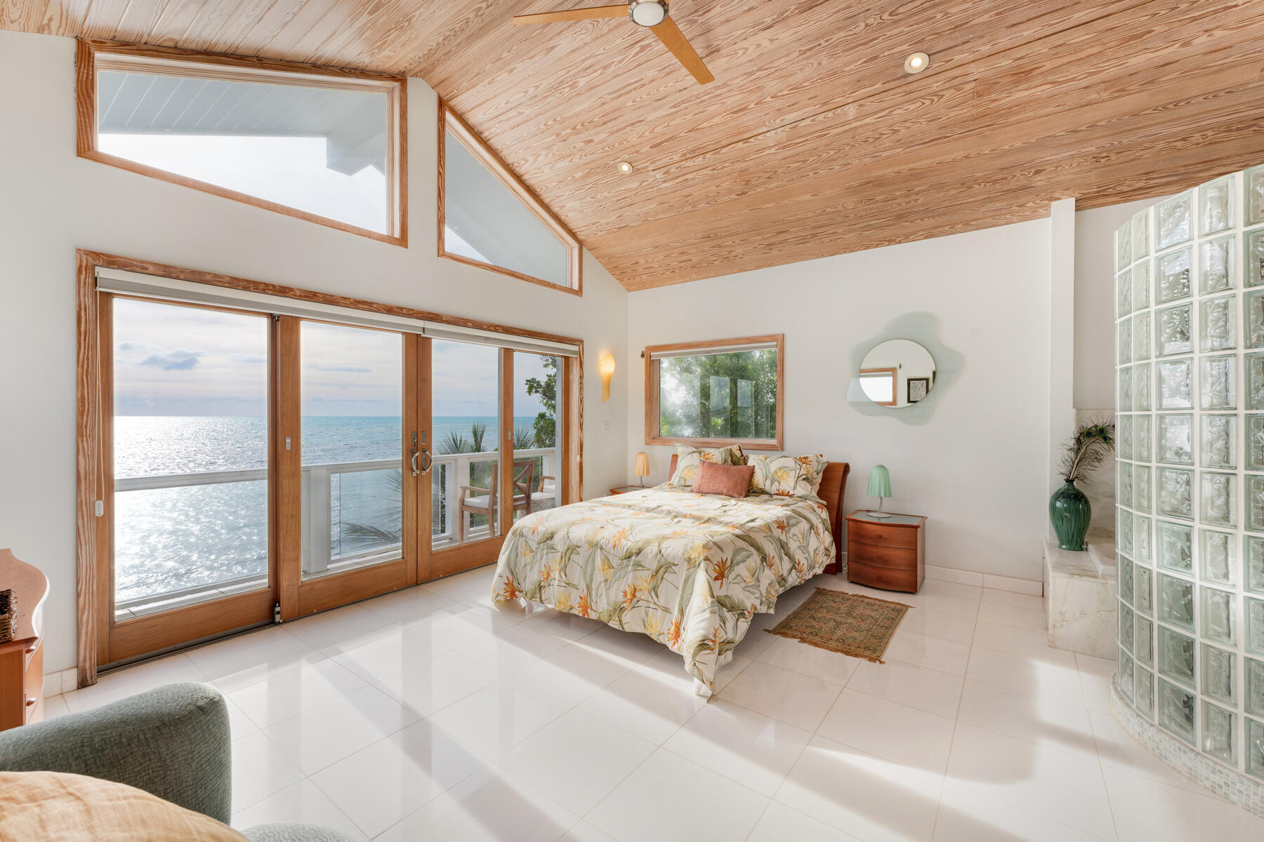 133 Sunset Drive Islamorada, FL 33036 - Photo 53 of 81 a spacious bedroom with a large bed and a large window