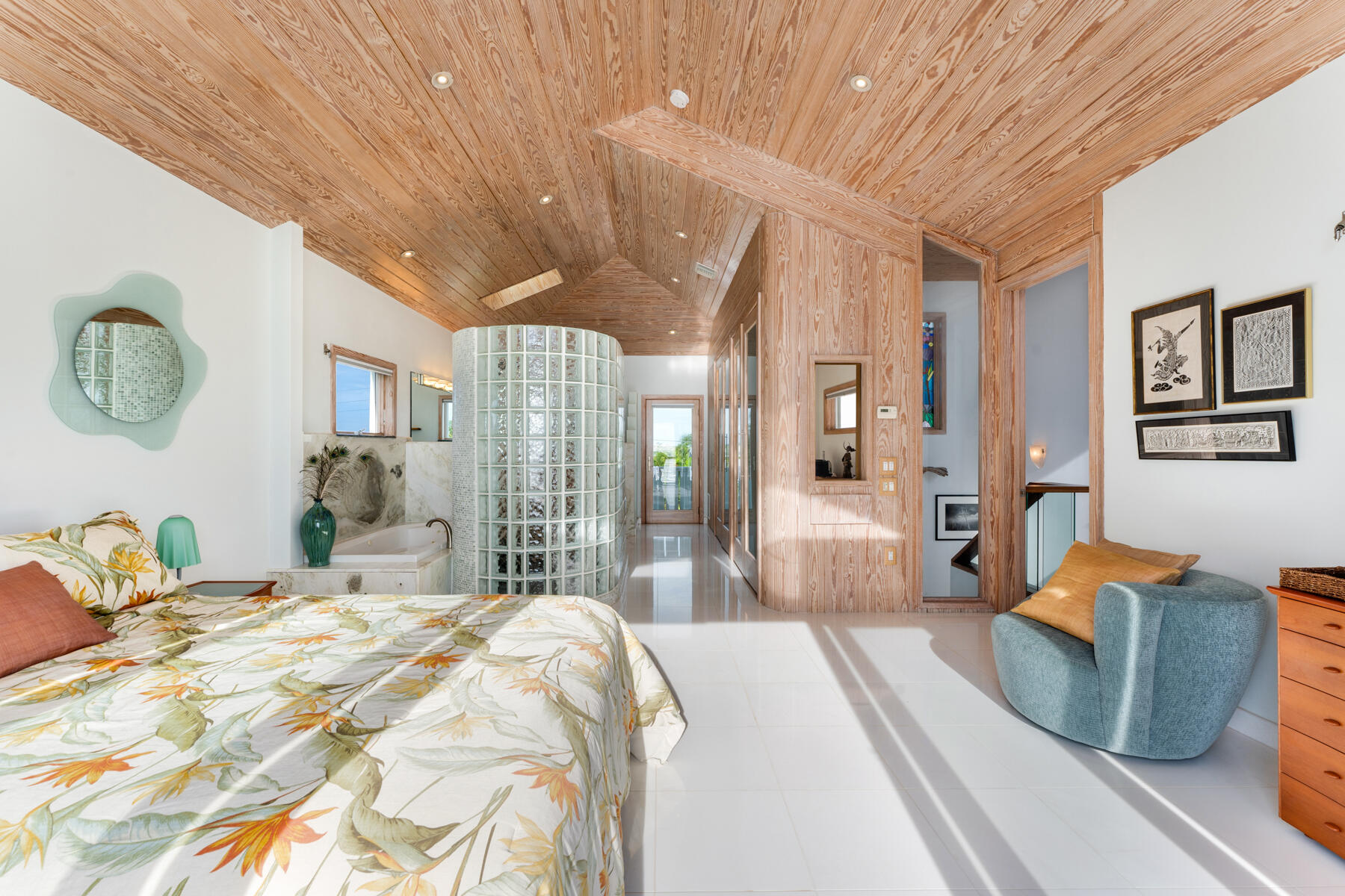 133 Sunset Drive Islamorada, FL 33036 - Photo 55 of 81 a bedroom with a large bed and wooden floor