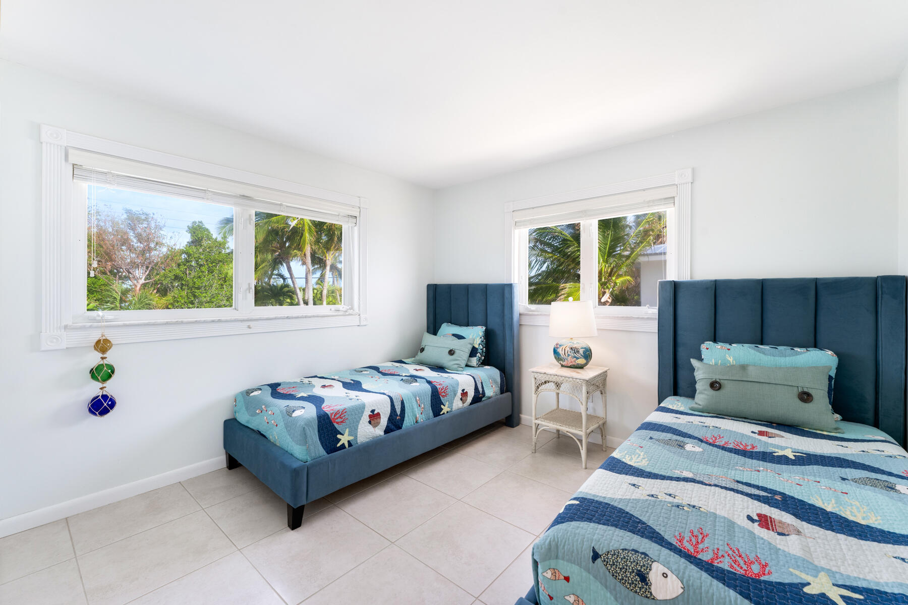 133 Sunset Drive Islamorada, FL 33036 - Photo 59 of 81 a bedroom with two beds and a window
