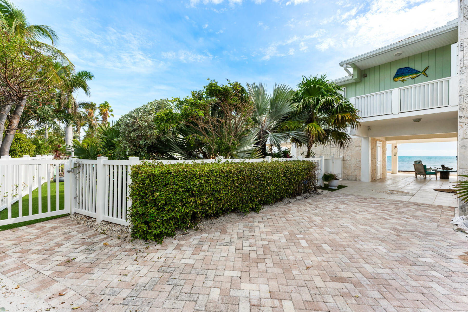 133 Sunset Drive Islamorada, FL 33036 - Photo 6 of 81 a view of a house with a small yard and plants