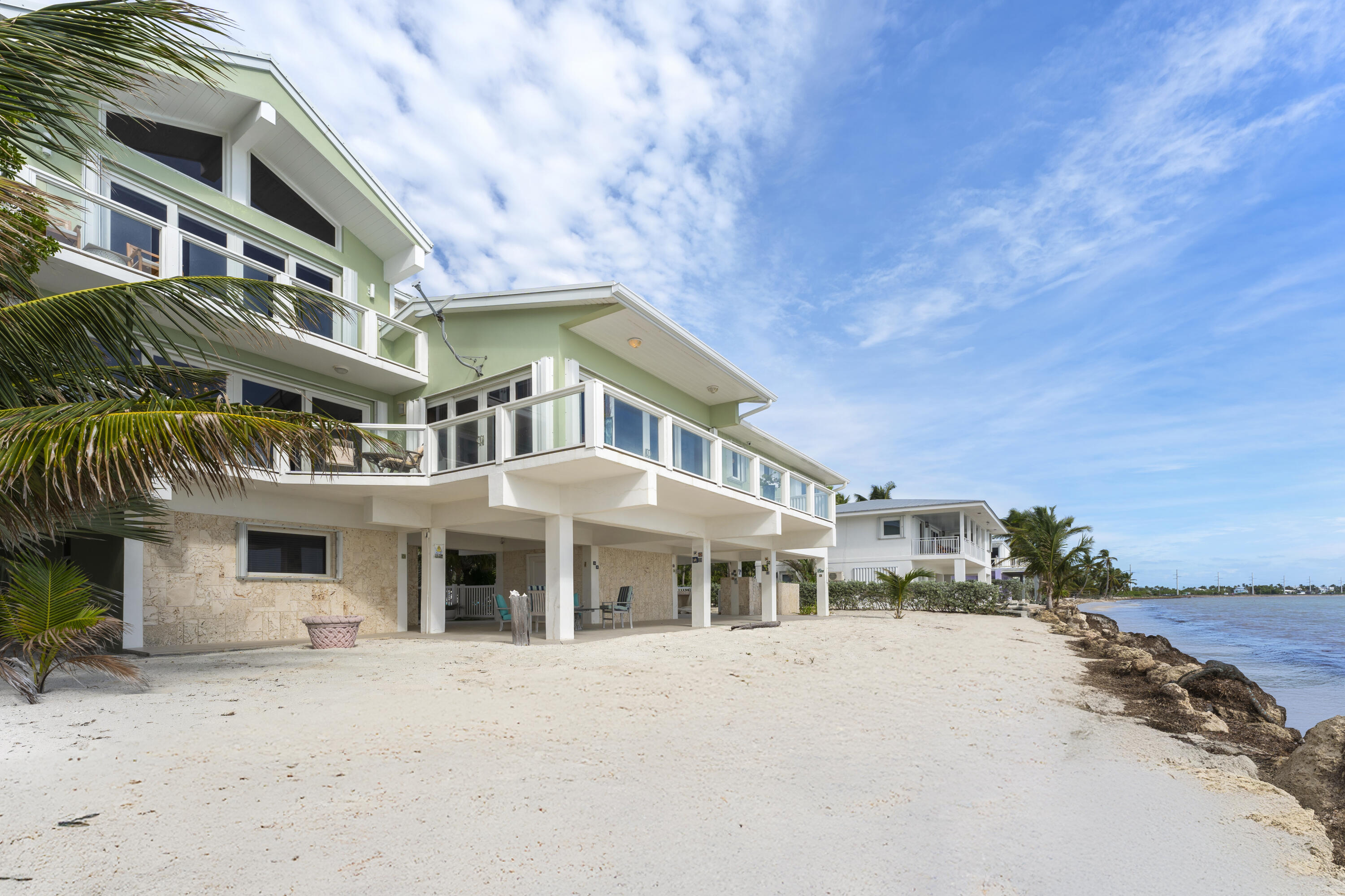 133 Sunset Drive Islamorada, FL 33036 - Photo 10 of 81 a front view of a building with many windows