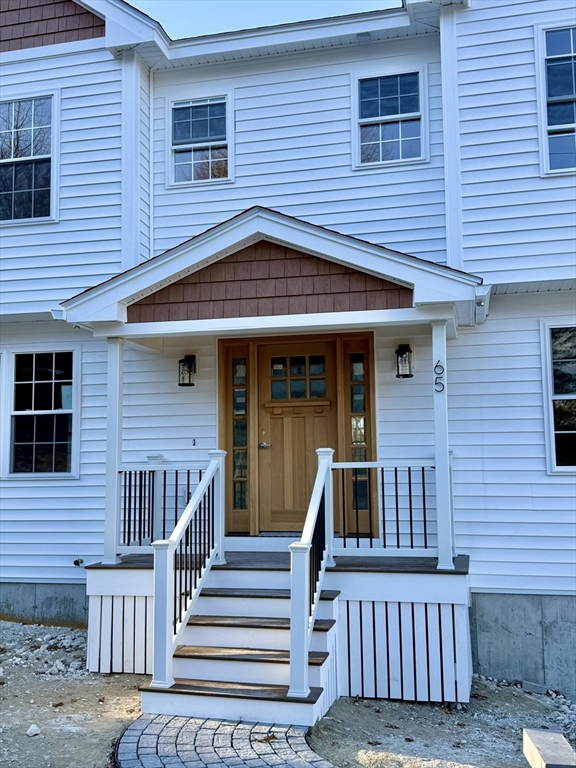 a front view of a house with a large window